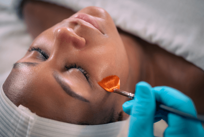 Woman relaxing during oxygenating treatment service at Massage Envy clinic. 